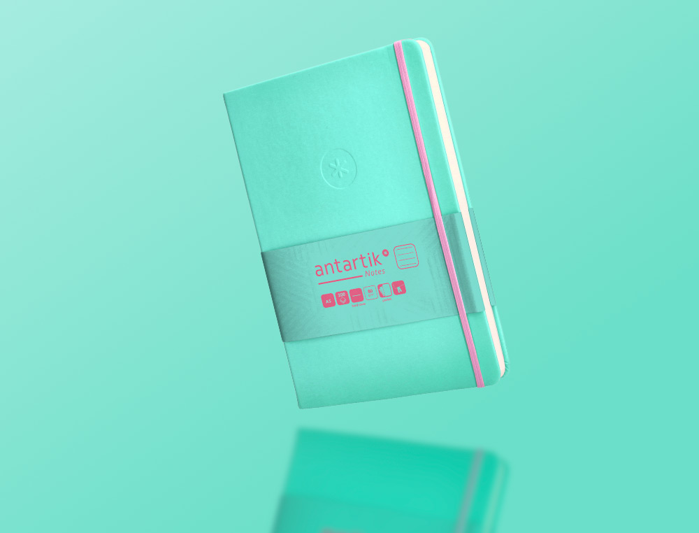 CUADERNO CON GOMILLA ANTARTIK NOTES TAPA DURA A5 HOJAS RAYAS ROSA Y TURQUESA 100 HOJAS 80 GR FSC