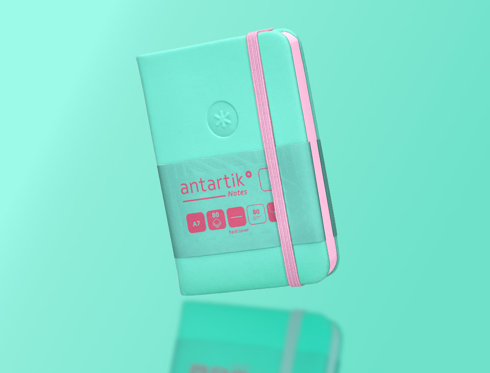 CUADERNO CON GOMILLA ANTARTIK NOTES TAPA DURA A7 HOJAS LISAS ROSA Y TURQUESA 80 HOJAS 80 GR FSC